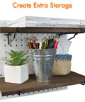 Two Pack Wooden Pegboard Shelves With Pro Grade Brackets And Thick Pegboard Hooks Durable Tool Organizer System holding books, plant, and bucket.