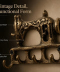 Slick Vintage Cast Iron Sewing Machine Wall Hook with raised relief details, 7.3in wide, open hanging rail for coats and keys.