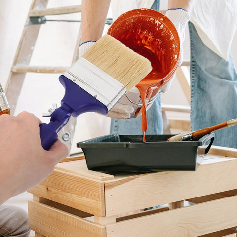 Adjustable 3 Inch Paint Brush With 270 Degree Angled Head And 2.6 Cm Aperture in use for painting with orange paint.