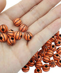 Basketball Beads Set For Crafting, 100 Pcs Lightweight Acrylic Spacer Beads With Big Holes And 4mm Bore in hand