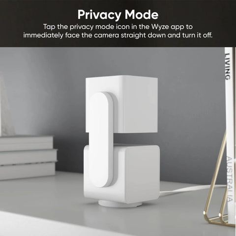 Pan Tilt 360 Degree 1080P WiFi Security Camera in privacy mode on a desk, showcasing its compact design and adjustable angle.