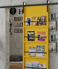 2 Pack White Nylon U Groove Pulley Wheels With 8mm Bore Heavy Duty Rail Tracks Silent Slider Rollers on a yellow sliding door with magazines.