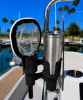 Heavy Duty Black Portable Clamp On Cup Holder And Versatile Dual Drink Caddy To Lock In Two Beverages, mounted on a boat.