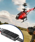 Lite-32 150A HV Opto RC ESC for Airplanes and Helis, Brushless Speed Controller installed in red helicopter, outdoors use