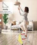 Person using 2 Step Folding Ladder With Handgrip, Heavy Duty Step Stool for home, anti slip wide pedal, in kitchen or living room