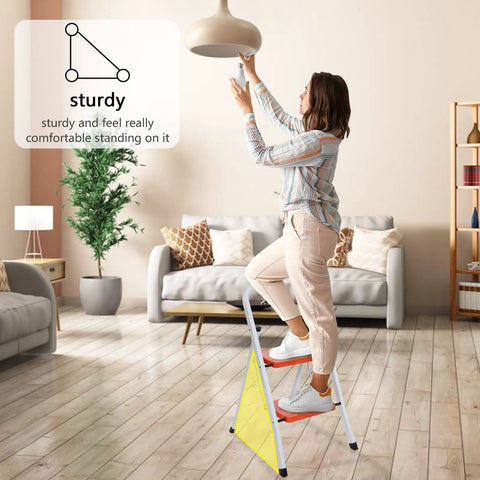 Person using 2 Step Folding Ladder With Handgrip, Heavy Duty Step Stool for home, anti slip wide pedal, in kitchen or living room