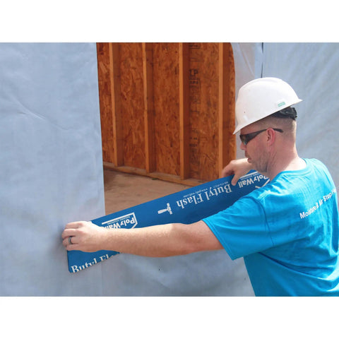 Worker applying Beefy Butyl Window Flashing Tape 4 Inch By 100 Foot Waterproof Self Adhering Self Sealing Weatherproof Sealant For Windows And Doors Down To 15 F UV Resistant Made In USA to a window frame