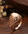 Fresh Rose Gold Oval Mesh Statement Ring For Women Featuring Sleek Polished Surface And Dope Openwork Grid Band seen on wooden surface.