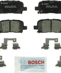 Bosch BC865 QuietCast rear ceramic brake pad set with mounting hardware and lubricant packet.