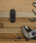 8 Piece Black Zinc Alloy Folding Table Flip Top Hinges With 180 Degree Round Edge Design on wooden surface with tools