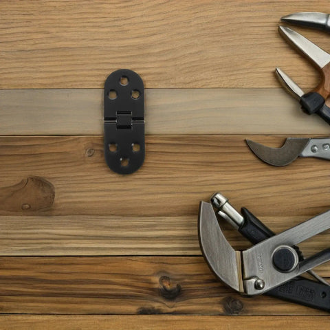 8 Piece Black Zinc Alloy Folding Table Flip Top Hinges With 180 Degree Round Edge Design on wooden surface with tools