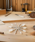 40 Piece Wool Felt Polishing Wheel Set With One Eighth Inch Shank For Drill Buffing Attachments on wooden workspace