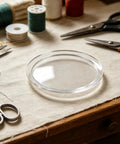 KT6808 Compatible Jewelry Tumbler Lid Transparent Round Barrel Cover on a crafting table with scissors and thread.