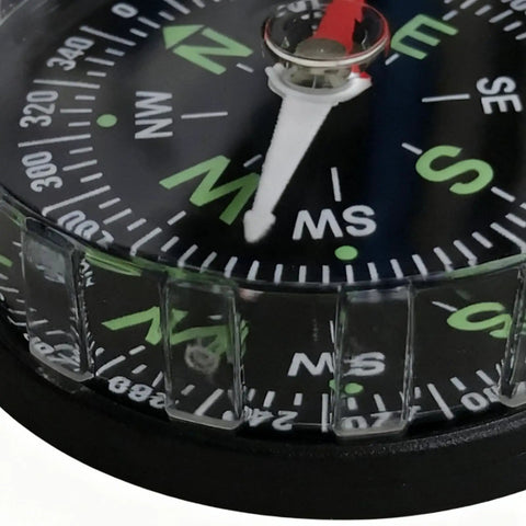 Close-up of Water Resistant Hiking Compass With Lensatic Bearing Guide, showing detailed compass face with lensatic markings.