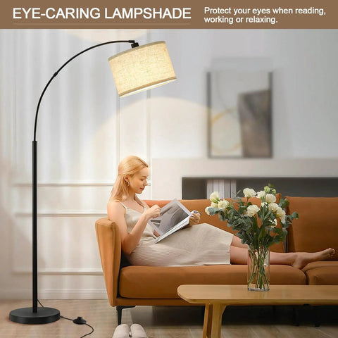 Woman reading under Arched 71 Inch Floor Lamp With Fully Dimmable 0 To 100 Percent Light And Foot Pedal Switch Adjustable Head in living room