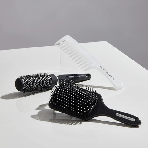 Express Ion Aluminum Round Brush For Blow Drying All Hair Types Large Vented Barrel With Corkscrew Vegan Bristles displayed with other brushes