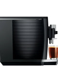 Next Level One Touch Automatic Coffee Maker In Slick Piano Black Finish Featuring Fresh Bean Grinding And Up To Seventeen Custom Drink Options For Home Setups Easy Peasy Controls Serve Up Straight Fire Espresso Every Single Day with coffee in glass.