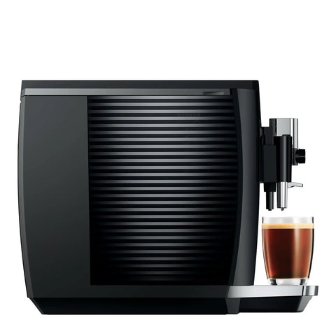 Next Level One Touch Automatic Coffee Maker In Slick Piano Black Finish Featuring Fresh Bean Grinding And Up To Seventeen Custom Drink Options For Home Setups Easy Peasy Controls Serve Up Straight Fire Espresso Every Single Day with coffee in glass.