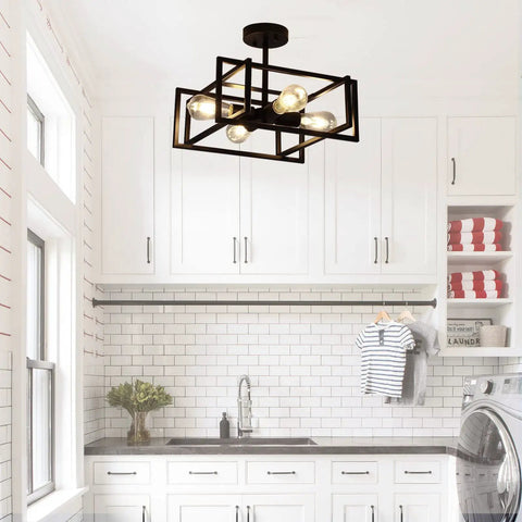 Slick Black 4 Light Ceiling Fixture, Industrial Farmhouse Flush Mount Chandelier in a bright white kitchen with exposed cube cage design.