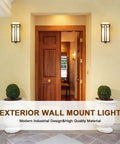 Outdoor Wall Mounted Porch Light Waterproof Exterior Lantern With Frosted Glass And Black Square Metal Frame Weather Resistant For Entryways Yards Garage Front Porch shown on yellow wall beside wooden door.