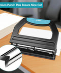 Beefed Up Heavy Duty 3 Hole Puncher For Binders With 9 By 32 Inch Holes, 50 Sheet Capacity, black metal puncher on wooden desk.