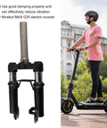 Front Suspension Fork For Electric Scooter With Shock Absorption Aluminum Alloy Construction Lightweight Easy Install Replacement Part Designed For Quick Install And Smooth Ride On Most Electric Scooters beside a person riding an electric scooter.
