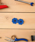 Top view of blue Aluminum Alloy Valve Handle Replacement Hexagonal Hand Wheel for Gas Cylinders on wooden surface with tools