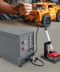 Premium Automatic Spot Welding Machine With Pulse Argon Arc Precision Control For Jewelry And Metal Crafts High Efficiency 50A To 600A Power Adjustable For Serious DIY Tinkering, with red model car and welder.