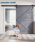 Gray Wood Barn Door Slab 54x84 Inches With 9 Foot Barn Door Hardware Track Kit Included installed in living room