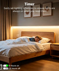 Bedroom with warm white LED strip lights behind a wooden bed; child sleeping, showcasing timer feature.