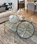 Glass tabletop with 100 Clear Cabinet Door Bumpers Half Inch Self Adhesive Rubber Feet Pads for surface protection and noise dampening.