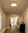 Close To Ceiling LED Flush Mount Light Fixture in modern brushed nickel with metal frame and acrylic shade in hallway setting