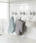 Heavy Duty Polished Chrome Crystal Wall Hook Top Shelf Bathroom Robe Hanger Straight Up Classy Silver Coat Rack Waterproof Design Works Wonders In Any Home Space with towels and oven mitts.