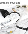 60 Inch Body Measuring Tape With Lock Pin And Push Button Retract on open magazine with plants, black design