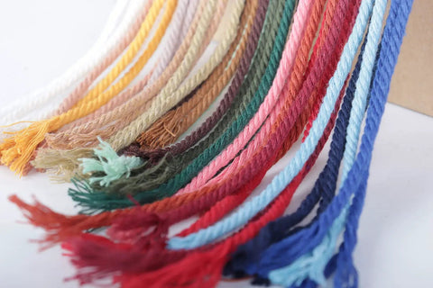 Colorful macrame cords in various shades including beige, showcasing options for macrame projects, not specific to Natural Macrame Cord 3mm 109 Yards Beige Cotton Rope For Wall Hangings Plant Hangers Christmas Crafts Knitting And DIY Projects Soft Durable Cotton Fiber Perfect For Macrame Wall Art Boho Planters Jewelry And Gift Wrap.