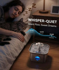 Person sleeping with cat near Quiet Stainless Steel Cat Water Fountain 2.8L With 20dB Ultra Quiet Pump, LED Water Level Window