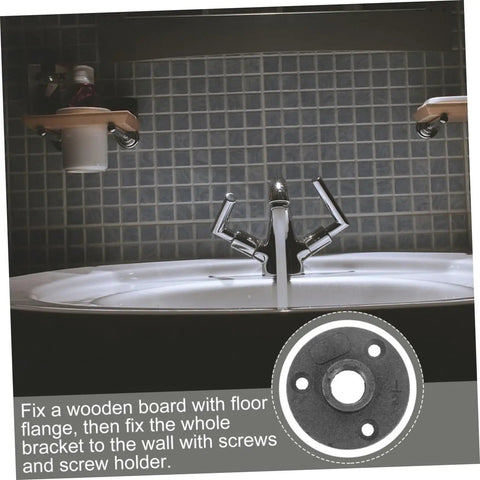 Close-up of a decorative floor flange set of 10 malleable iron fittings used with a sink installation in a bathroom.