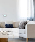 Living room with 7 Day Flexible Programmable Thermostat With Extra Large Backlit Display White on wall.