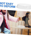 Child reaching for cotton candy with clear Cotton Candy Machine Guard Cover For Sugar Floss Makers Lightweight And Reusable Enclosure nearby.