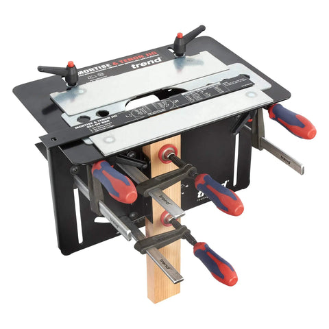 Dead On Mortise And Tenon Jig For Plunge Routers Slick Adjustable Woodworking Jig For Cabinets and Tables with clamps attached.