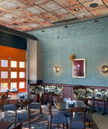 Restaurant interior with Ridged Metal PVC 2x2 Lay In Ceiling Tile For Quick Ceiling Makeover Adds Crisp Design And Stunning Finish
