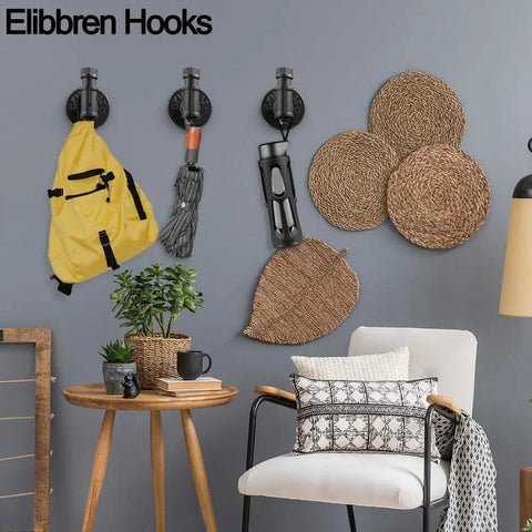 Industrial Pipe Wall Hooks Set Of 2 For Bathroom And Coat Rack, holding yellow backpack and umbrella, rustic decor setting.