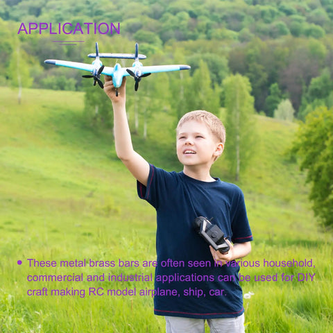 Child holding model airplane using Brass Rod Set 25 Pack 12 Inch Long 3/32 Inch Diameter Solid Round Brass Rods for DIY craft.