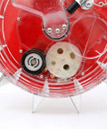 Close-up of Durable Metal Precision Garden Seeder with clear seed storage box showing internal mechanisms for precise planting.