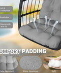Close-up of comfort padding on egg chair with stand for patio and garden, UV resistant cushion displayed, wicker rattan seen