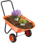 Heavy Duty Workhorse Garden Dump Cart With 5 Cu Ft Load And 397 Lb Capacity Two Wheel Wheelbarrow filled with soil and flowers