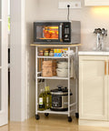 Super Smooth Rollin 4 Tier Microwave Cart With Gotta Have Storage For Coffee Bar Printer Stand Or Kitchen Counter Easy Glide Wheels with microwave and jars.