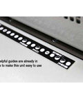 Close-up of guide ruler on Heavy Duty Electric Coil Punch Machine For Bindery with 4x5mm oval holes and 54 disengageable pins.
