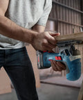 User operating Real Deal 18V Cordless Jigsaw Packing on plywood, showcasing quick swap blades and dust extraction.