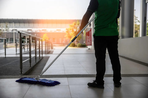 Badass Heavy Duty Dust Mop Kit With Telescopic Handle Twisted Closed Loop Head Killer Dust Pickup Smooth Glide For Pro Commercial Floor Cleaning in use on tile floor.
